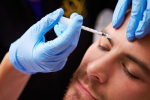 A man during a Botox procedure in Rochester Hills, MI